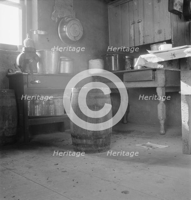 Corner of Roberts' one-room basement dugout, Malheur County, Oregon, 1939. Creator: Dorothea Lange.