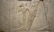 Relief of legs of Mereruka with his wife Watetkhethor..., Mastaba of Mereruka, Egypt, 2003.   Creator: Unknown.