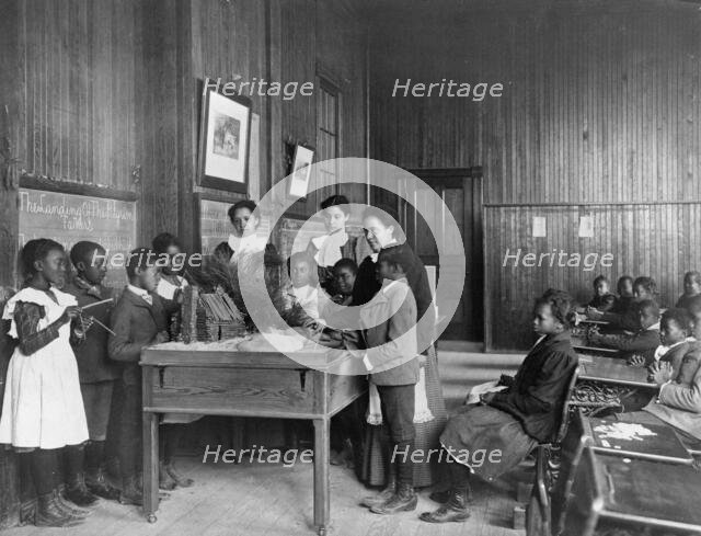 Thanksgiving Day lesson at Whittier, 1899 or 1900. Creator: Frances Benjamin Johnston.
