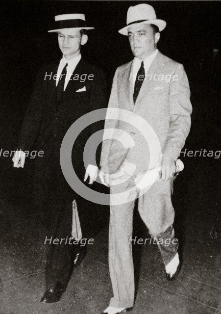 J Edgar Hoover, chief of the FBI, with head of the Chicago office Melvin Purvis, USA, mid 1930s. Artist: Unknown