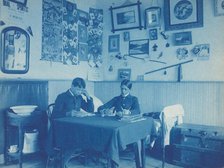 Carlisle Indian School, Carlisle, Pa. Two boys studying in dormitory room, 1901. Creator: Frances Benjamin Johnston.