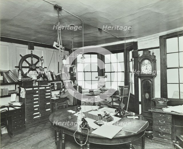 Interior of an office with a man on the telephone, Greenwich, London, November 1936. Artist: Unknown.