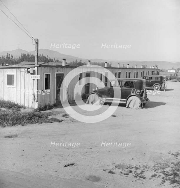Ten cabins which rent for ten dollars..., Arkansawyers...camp, Greenfield, Salinas Valley, CA, 1939. Creator: Dorothea Lange.