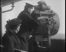 British Royal Navy Officer Looking Through a Telescope With a Searchlight at  the Norwegian..., 1940 Creator: British Pathe Ltd.