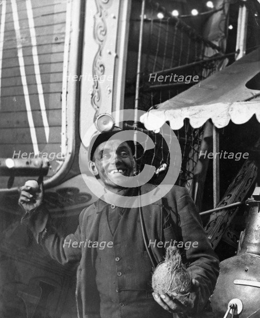 Miner at a fairground, Conisbrough, near Doncaster, South Yorkshire, 1955. Artist: Michael Walters