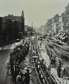 Tramline being laid in the middle of the road, Whitechapel High Street, London, 1929. Artist: Unknown.