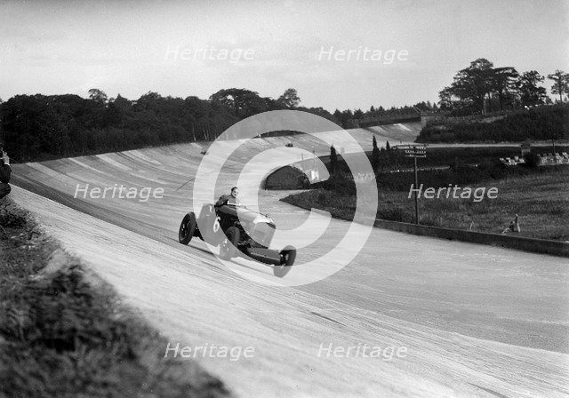 FE Elgood driving a Bentley at the MCC Members Meeting, Brooklands, 10 September 1938. Artist: Bill Brunell.