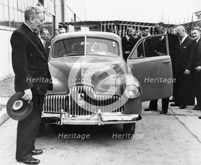 1948 Holden 48-215 with Australian Prime Minister J.B. Chifley. Creator: Unknown.
