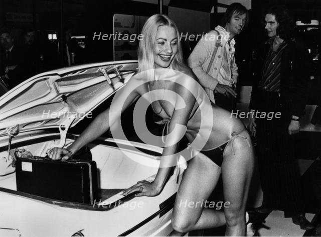 Female model in bikini at 1976 Motor Show, Earl's Court. Creator: Unknown.