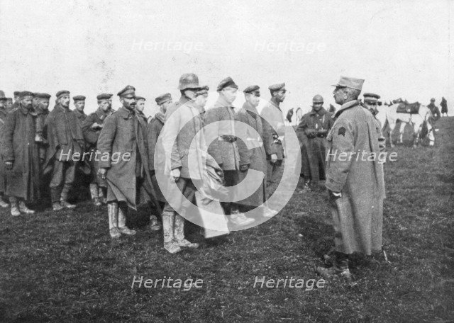 German prisoners taken on 18 April 1918 being told the rules of their captivity, France. Artist: Unknown