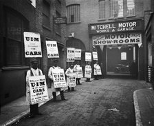 Sandwich board men advertising outside Mitchell Motors, 114 Wardour Street, London, 1910. Artist: Bedford Lemere and Company.