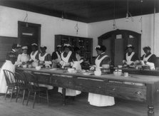 Ten Afro-American women in cooking class at Hampton Institute, Hampton, Va., between 1899 and 1900. Creator: Frances Benjamin Johnston.