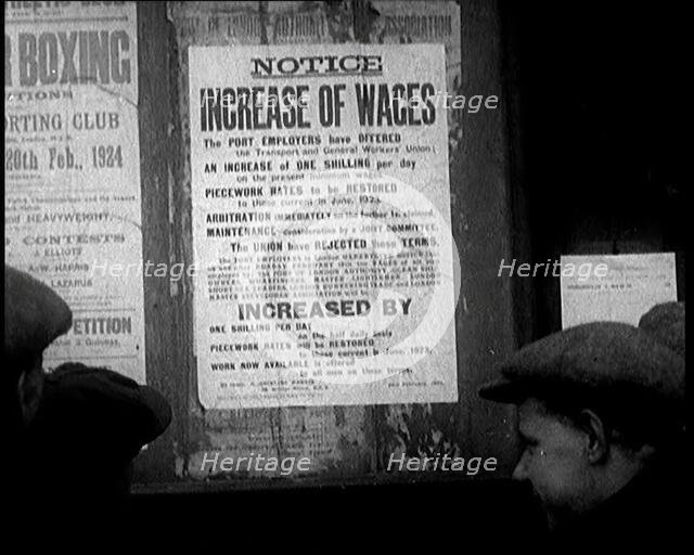 A Group of People Looking at a Sign. the Sign Reads 'Notice Increase of Wages', 1924. Creator: British Pathe Ltd.