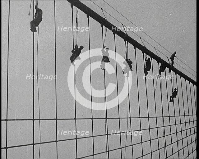 Men Painting the Brooklyn Bridge in New York City, 1922. Creator: British Pathe Ltd.