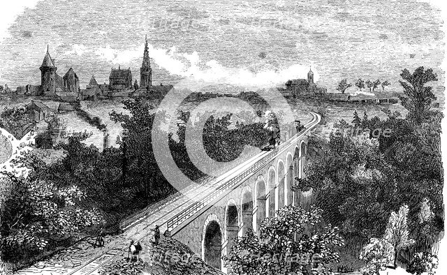 Railway line from Vitré to Fougères. Pass of a steam train by the viaduct on the Vilaine near Vit…