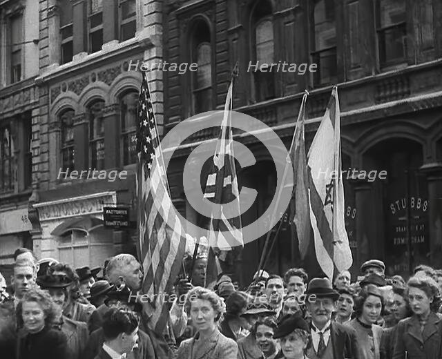 British Civilians Watching American Troops March Through London, 1942. Creator: British Pathe Ltd.