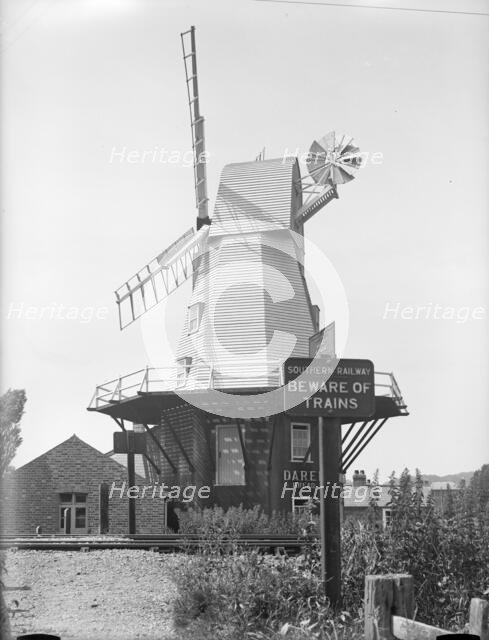 Gibbet smock mill from the opposite side of the Ashford and Hasting Railway line, East Sussex, 1934. Creator: HES Simmons.