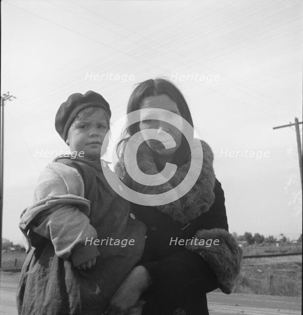 Homeless mother and youngest child of seven...US99, near Brawley, Imperial County, 1939. Creator: Dorothea Lange.