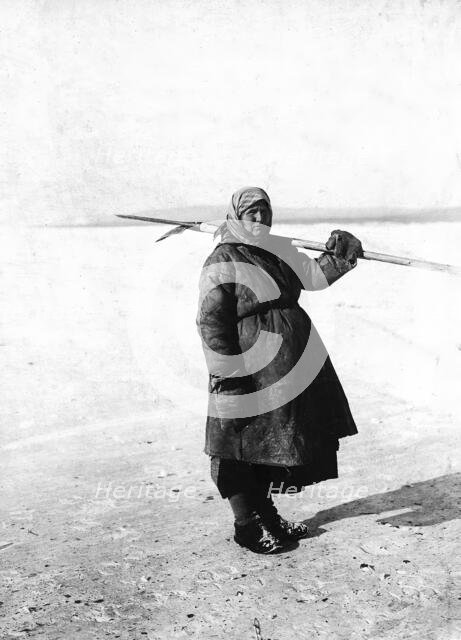 An Angarsk peasant woman goes to check the ouds, 1911. Creator: Unknown.
