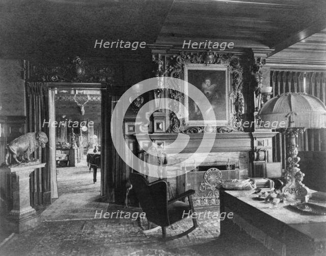 Study with portrait of woman in Elizabethan dress, over fireplace..., Greenwich, Connecticut, 1908. Creator: Frances Benjamin Johnston.