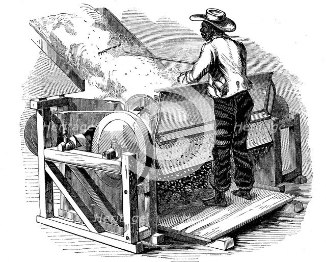Saw gin for cleaning cotton being operated by barefoot black labourer, southern USA, 1865. Artist: Unknown