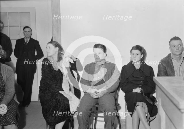 Night meeting in the Farm Security Administration office, Visalia, Tulare County, California, 1938. Creator: Dorothea Lange.
