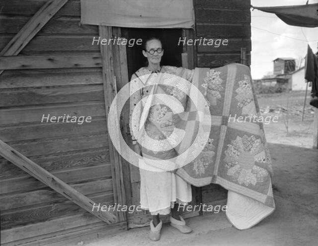 Grandmother from Oklahoma and her pieced quilt, California, Kern County, 1936. Creator: Dorothea Lange.