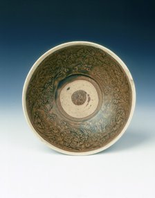 White rimmed celadon bowl with moulded peony scrolls, Jin dynasty, China, 13th century. Artist: Unknown