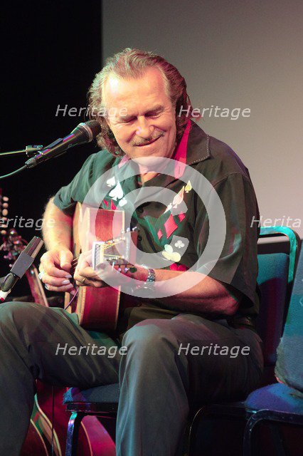 Hans Theessink, Hawth, Crawley, West Sussex, 2014.  Artist: Brian O'Connor.