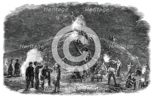 The Deptford Rifle Corps (34th Kent) forming earthworks for their shooting-ground by torchlight,1860 Creator: Unknown.