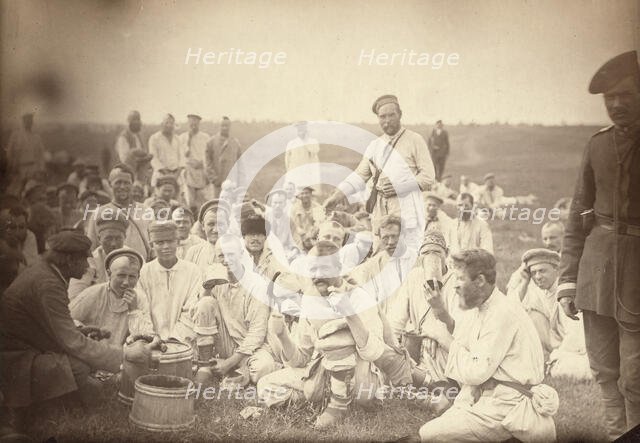 Siberian convicts taking lunch by the roadside (common criminals), between 1885 and 1886. Creator: Unknown.