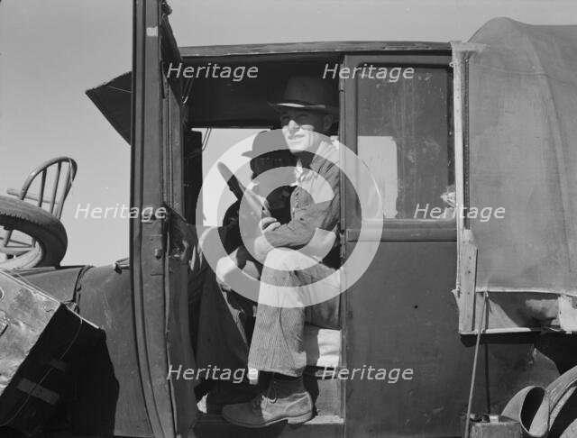 Texas family looking for work in the carrot harvest, California, 1937. Creator: Dorothea Lange.