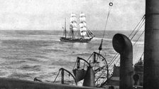 At sea; During boarding, a patrol cruiser turns on the visiting vessel which it encircles..., 1917. Creator: Unknown.