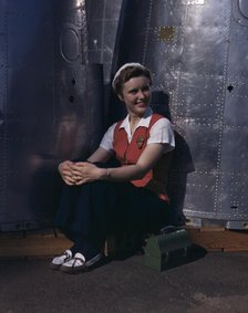 A noontime rest for a full-fledged...Long Beach, Calif., plant of Douglas Aircraft Company, 1942. Creator: Alfred T Palmer.