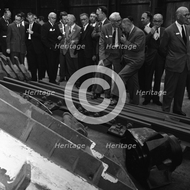 Inspecting a tram junction, made at the Edgar Allen Steel Foundry, Meadowhall, Sheffield, 1962. Artist: Michael Walters