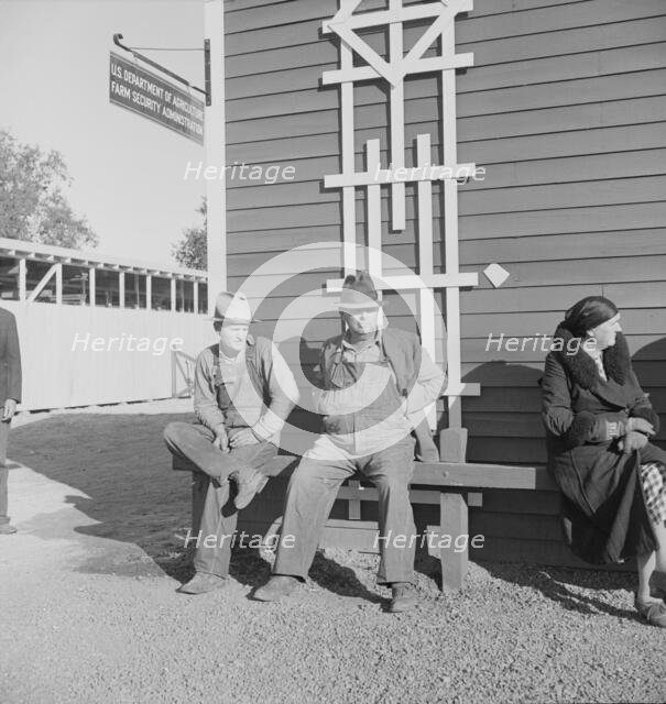 Lineup outside of Farm Security Administration grant office early in the morning, Tulare, CA, 1938. Creator: Dorothea Lange.