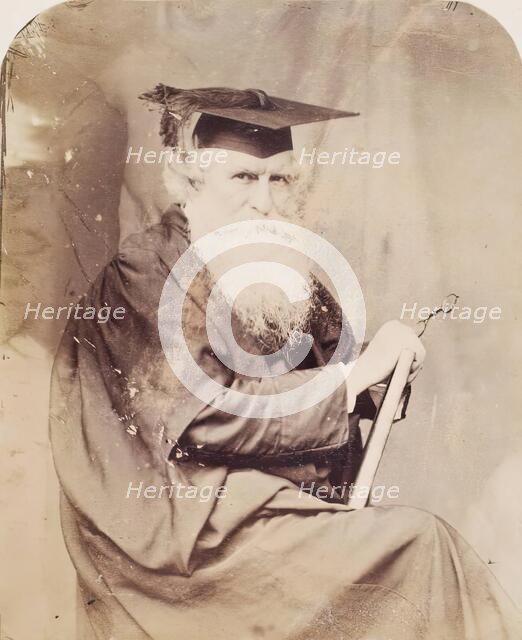 Thomas Combe in Cloak and Mortar Board, from an album compiled by John Everett Millais, 30 June 1860 Creator: Lewis Carroll.