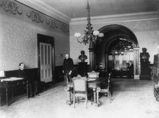 The office lobby in the White House, between 1889 and 1906. Creator: Frances Benjamin Johnston.
