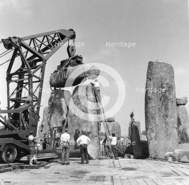 Re-erection of Trilithon lintel, Stonehenge, Wiltshire, 1958. Artist: Richard J C Atkinson.