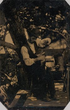 Tinsmith Working Under a Tree, 1870s. Creator: Unknown.