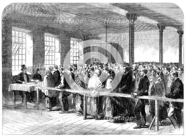 The Cotton Famine: distributing tickets for bread, soup, meat, meal, coal etc, Manchester, 1862. Creator: Unknown.