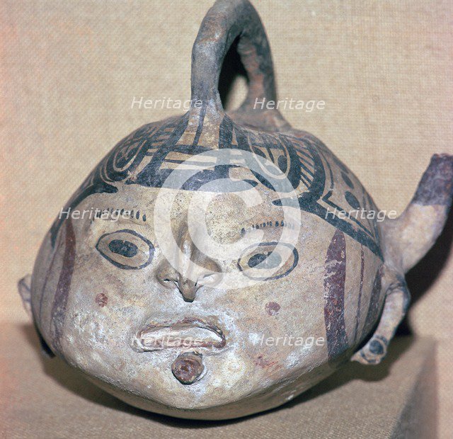 Huaxtec culture spouted jug painted with a human face. Artist: Unknown
