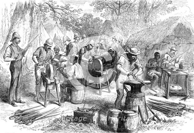 The Ashantee War: sharpening cutlasses...at Prah-Su, from a sketch by our special artist, 1874. Creator: Unknown.