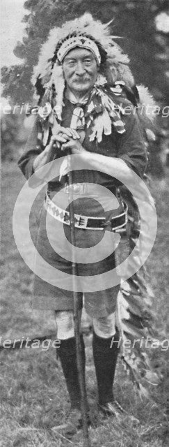 'Sir Robert Baden-Powell, arrayed in the dress of a Red Indian tribe', c1925. Creator: Unknown.