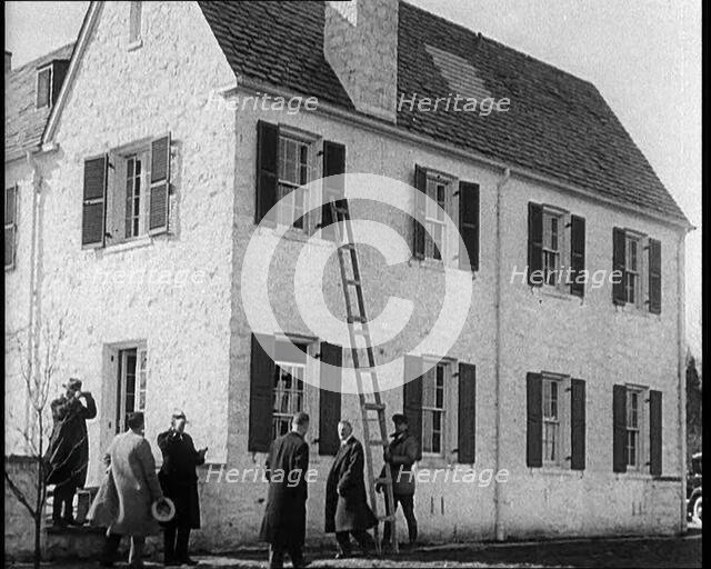 Male American Civilians in Front of American Aviator Charles Augustus Lindbergh's House..., 1930s. Creator: British Pathe Ltd.