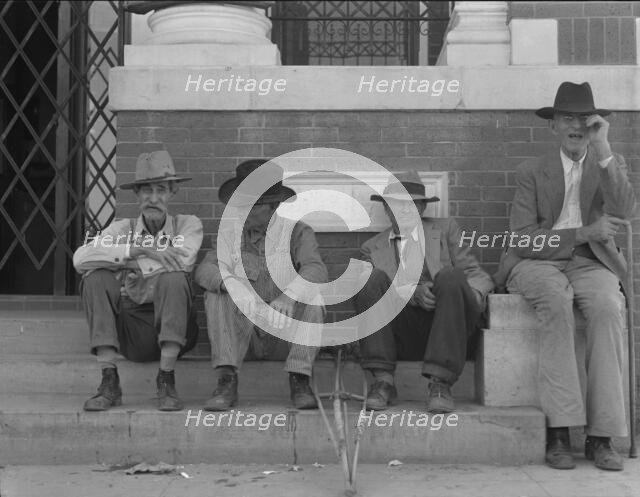On the steps of the bank in the town square, Memphis, Texas, 1937. Creator: Dorothea Lange.