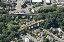 A train crossing a viaduct on the Poole and Bournemouth Railway, Poole, Dorset, 2018. Creator: Historic England.