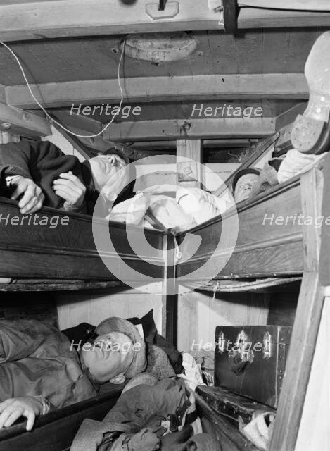 Gloucester fishermen resting in their bunks after unloading their catch at the..., New York, 1943. Creator: Gordon Parks.