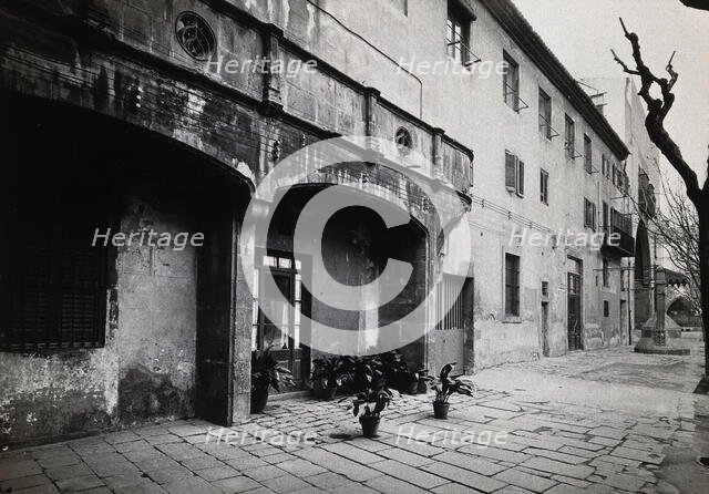 Hospital de la Santa Cruz, Barcelona: a long view of the courtyard. Creator: Unknown.