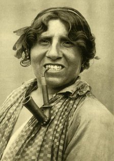 Gipsy woman smoking a pipe, Burgenland, Austria, c1935. Creator: Unknown.